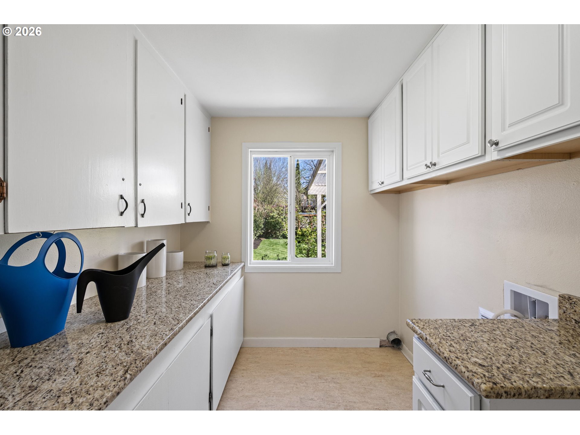 1255 Taylor Street Eugene, OR 97402 - Photo 22 of 48 a kitchen with granite countertop a sink a stove and cabinets