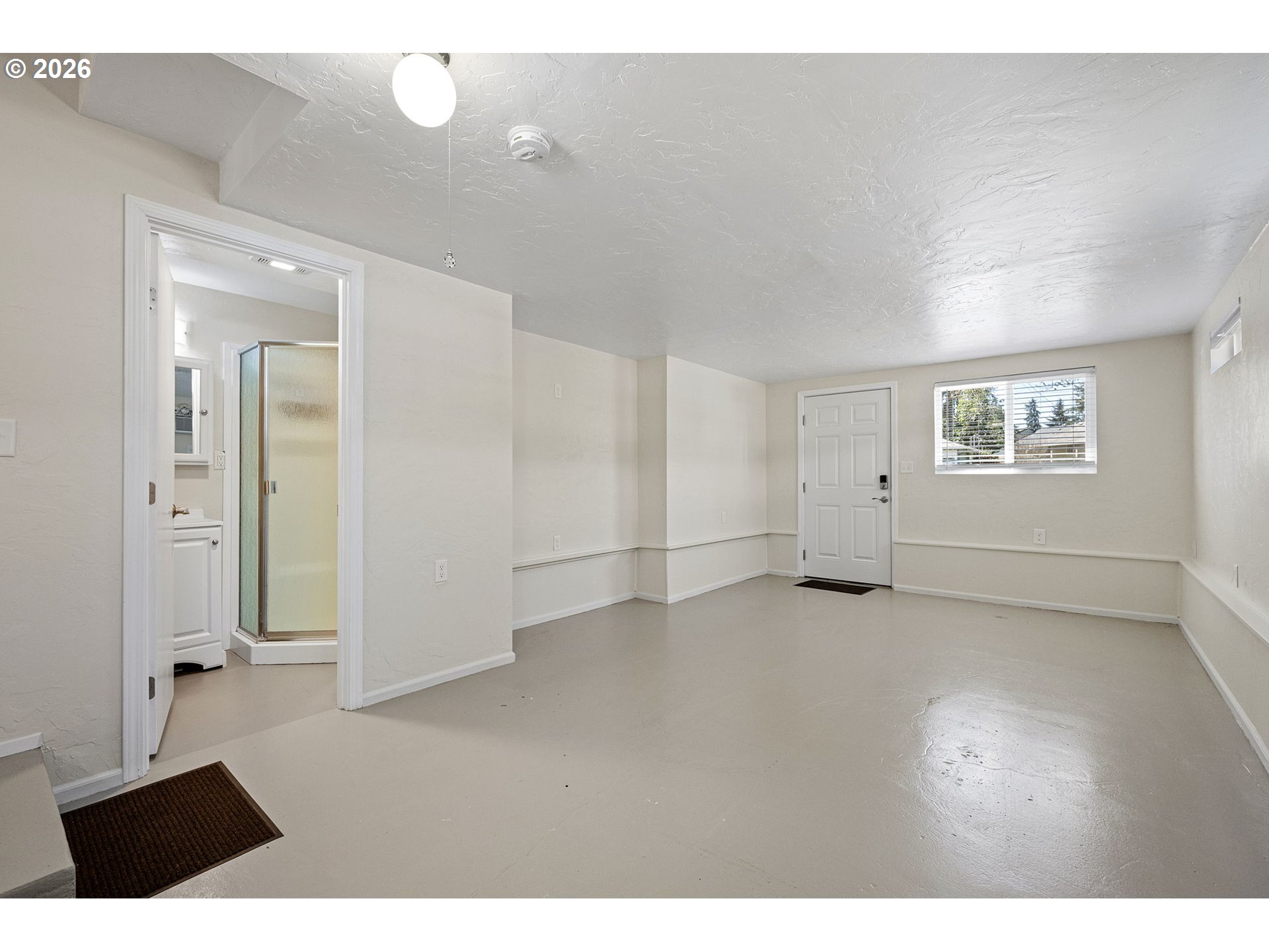 1255 Taylor Street Eugene, OR 97402 - Photo 25 of 48 a view of an empty room with a window