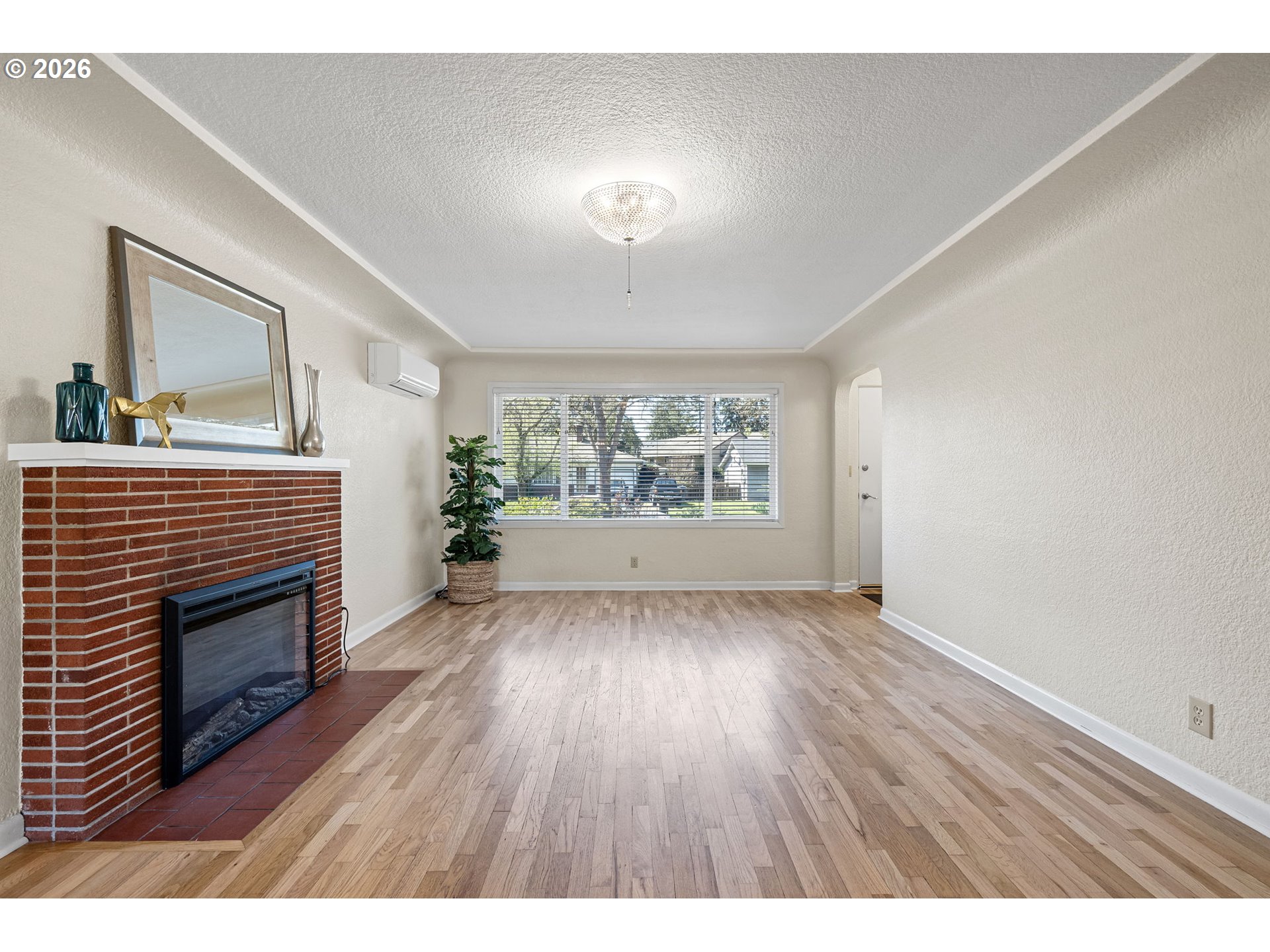 1255 Taylor Street Eugene, OR 97402 - Photo 29 of 48 a view of an empty room with a fireplace and a window