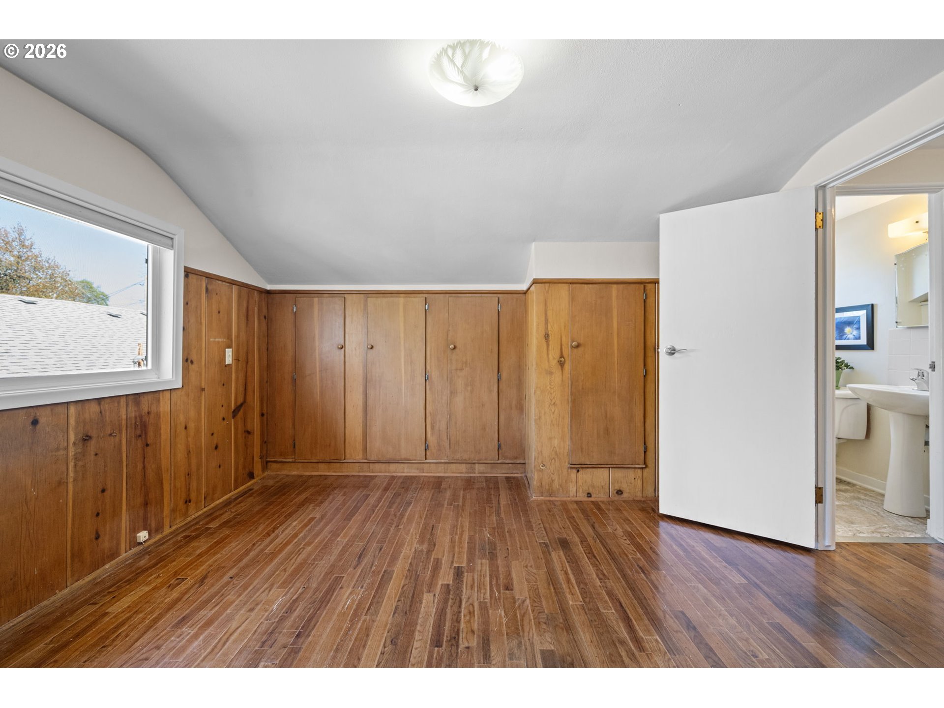 1255 Taylor Street Eugene, OR 97402 - Photo 35 of 48 a view of an empty room with wooden floor