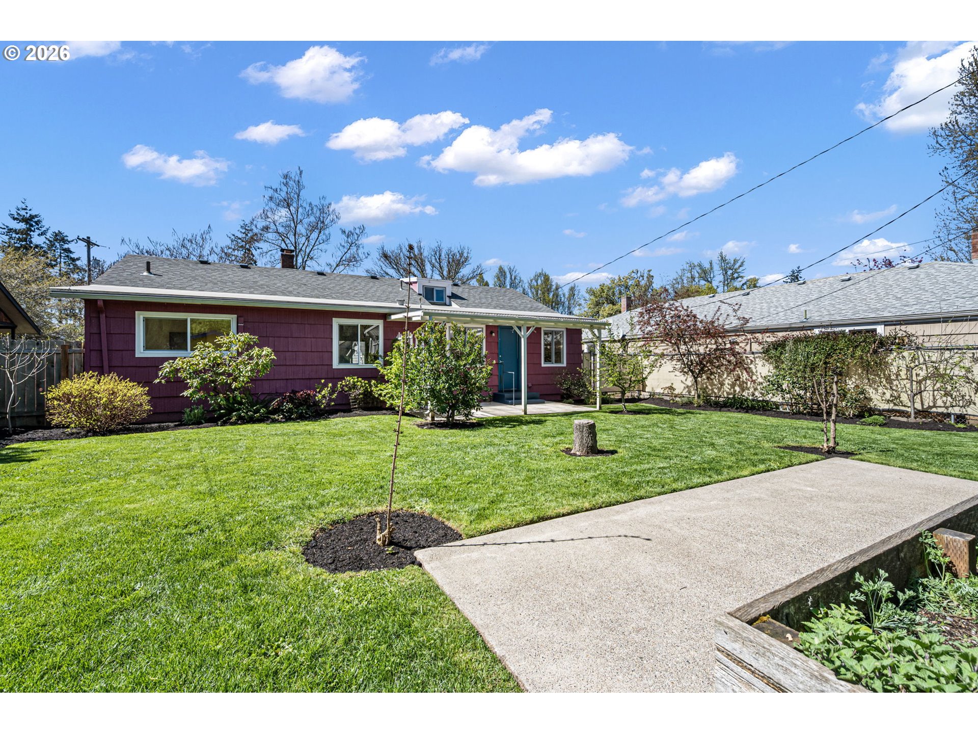 1255 Taylor Street Eugene, OR 97402 - Photo 41 of 48 a view of a house with a yard and potted plants