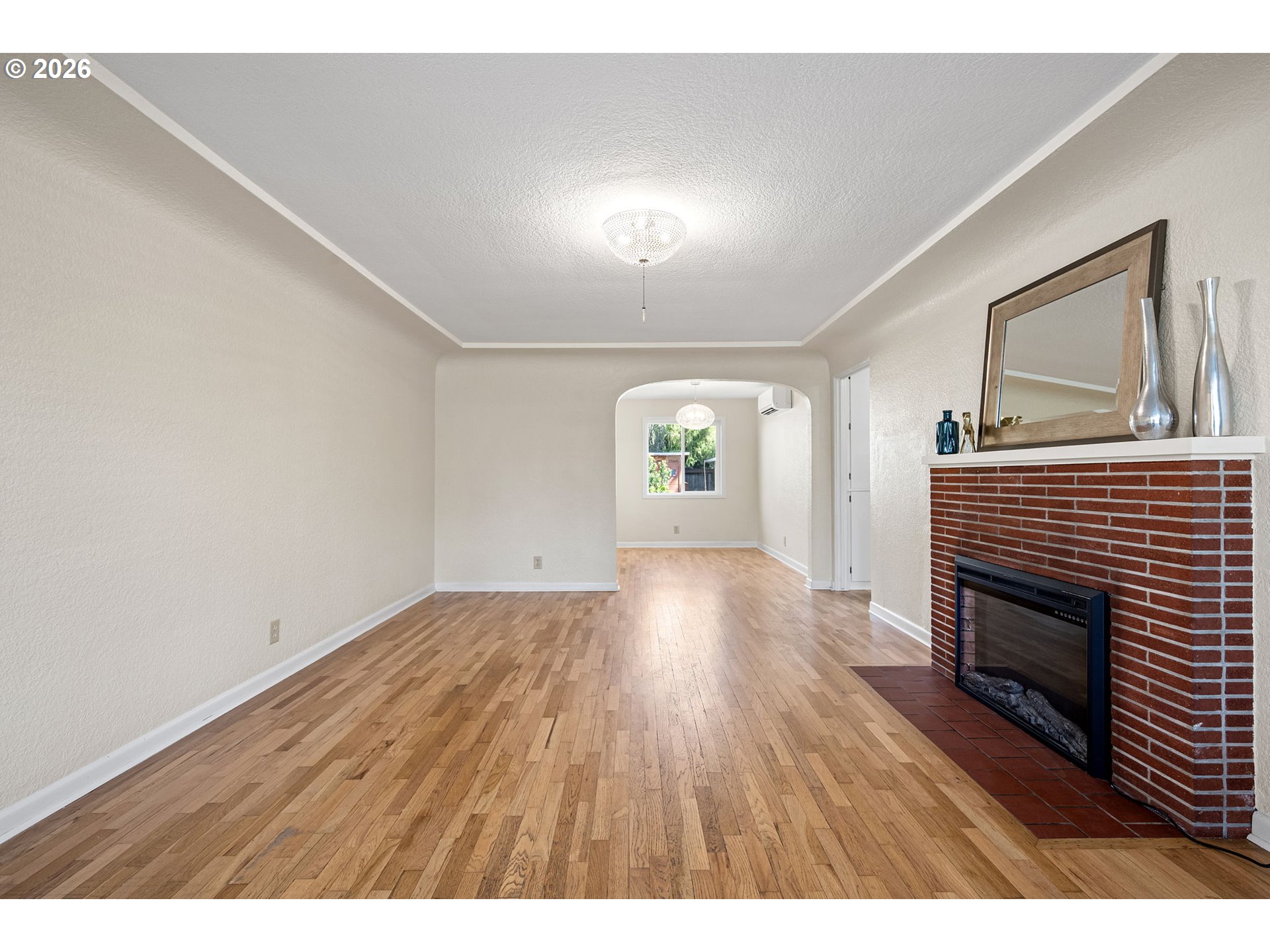 1255 Taylor Street Eugene, OR 97402 - Photo 3 of 48 a view of empty room with wooden floor and fireplace