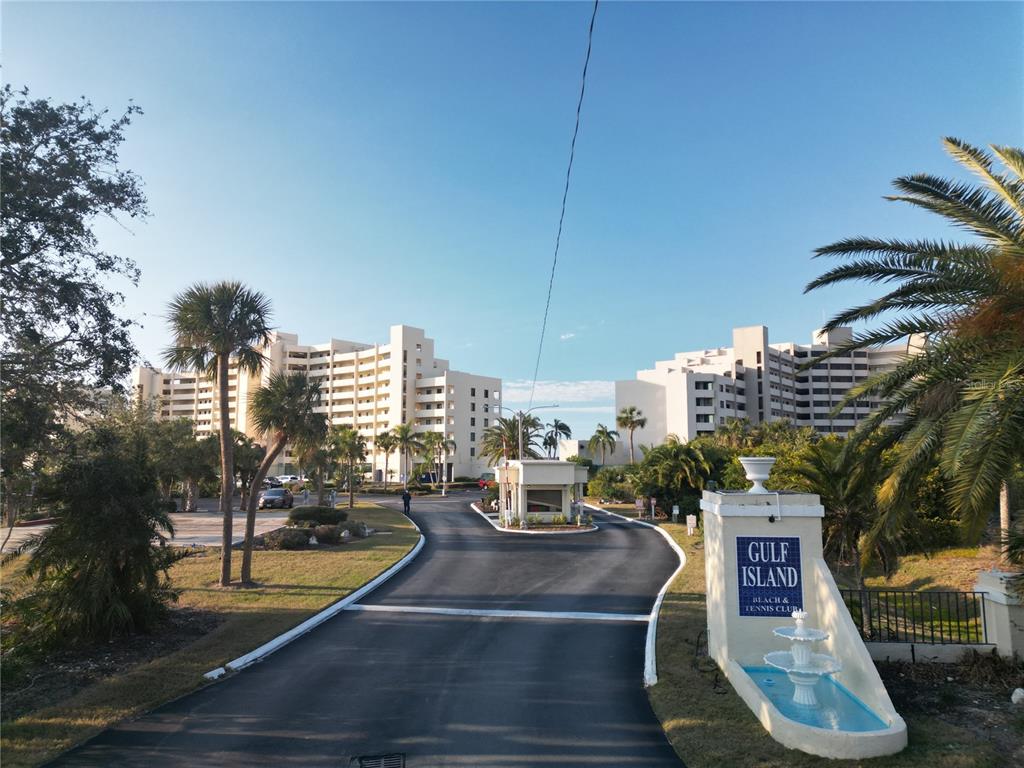 5915 Sea Ranch Drive, Unit 704 Hudson, FL 34667 - Photo 15 of 62 a sign board with buildings in the background