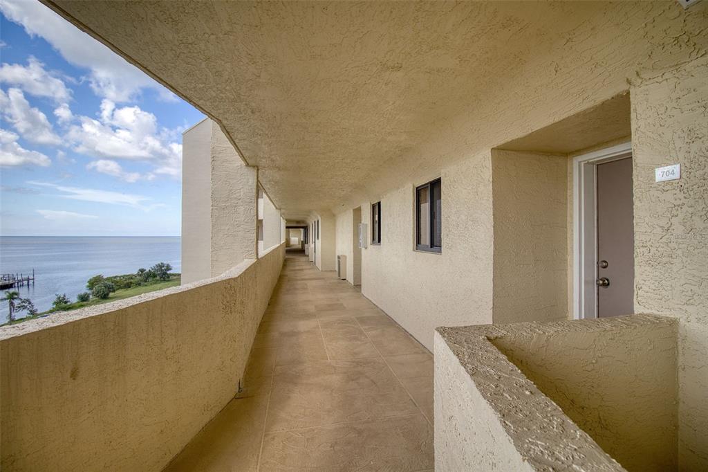 5915 Sea Ranch Drive, Unit 704 Hudson, FL 34667 - Photo 17 of 62 a view of balcony and living room