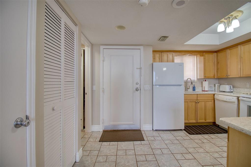5915 Sea Ranch Drive, Unit 704 Hudson, FL 34667 - Photo 19 of 62 a utility room with cabinets washer and dryer