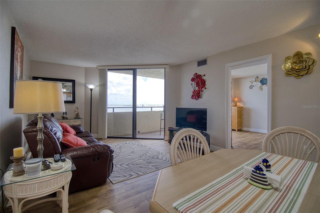 5915 Sea Ranch Drive, Unit 704 Hudson, FL 34667 - Photo 26 of 62 a bedroom with furniture and a flat screen tv