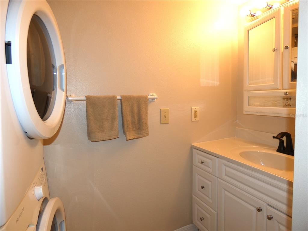 5915 Sea Ranch Drive, Unit 704 Hudson, FL 34667 - Photo 39 of 62 a bathroom with a sink a toilet and a mirror