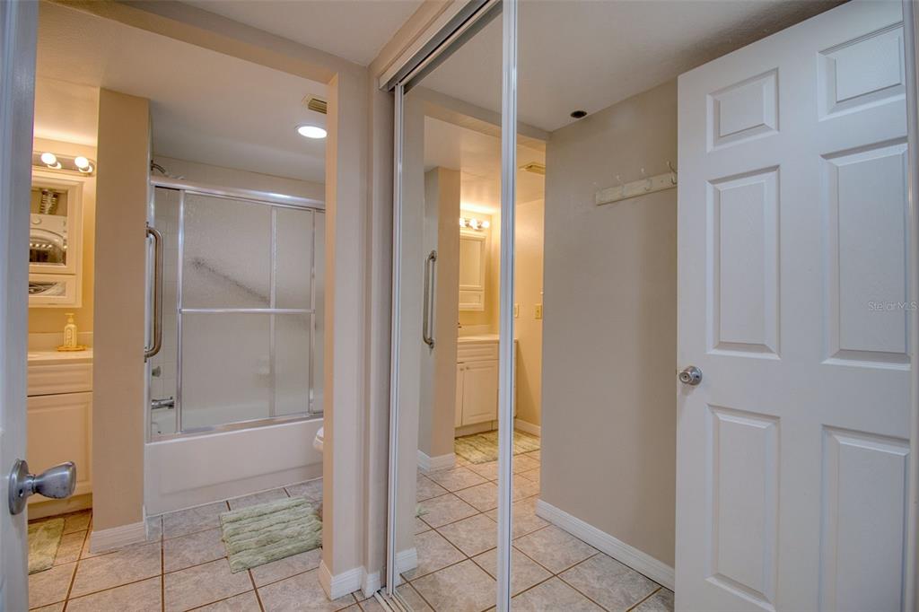 5915 Sea Ranch Drive, Unit 704 Hudson, FL 34667 - Photo 40 of 62 a bathroom with a shower and a glass door