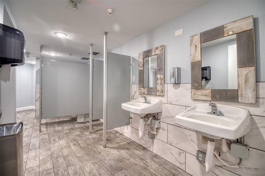 5915 Sea Ranch Drive, Unit 704 Hudson, FL 34667 - Photo 58 of 62 a bathroom with a sink and a mirror