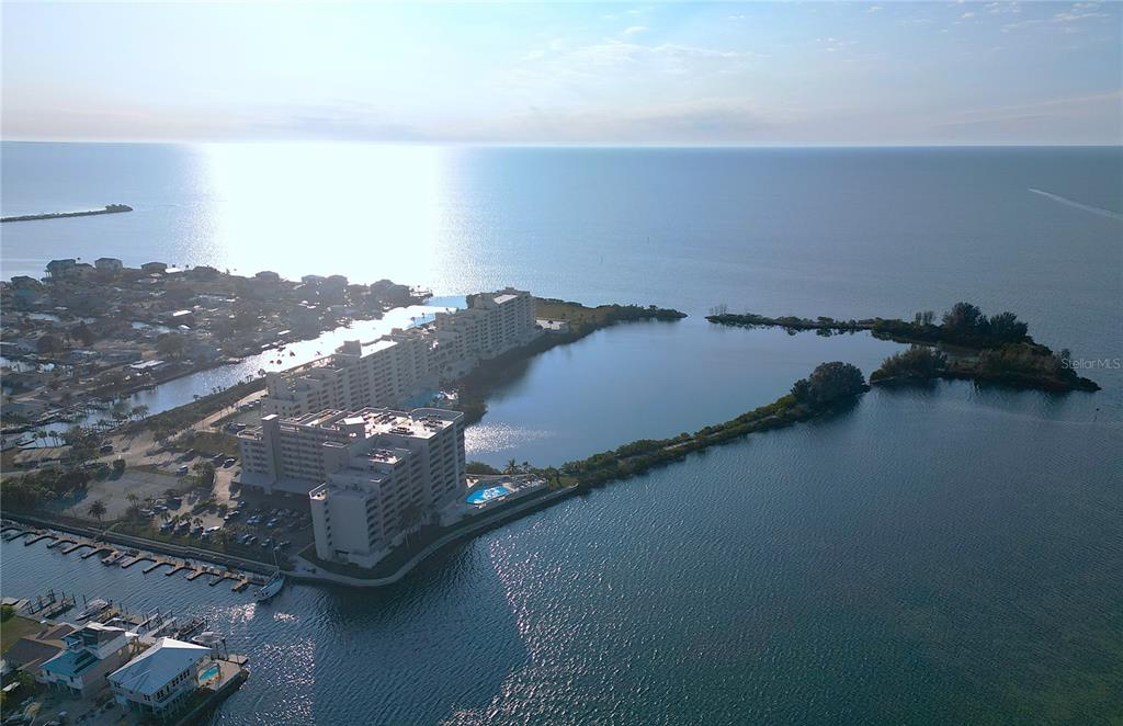 5915 Sea Ranch Drive, Unit 704 Hudson, FL 34667 - Photo 7 of 62 an aerial view of residential houses with outdoor space and seating