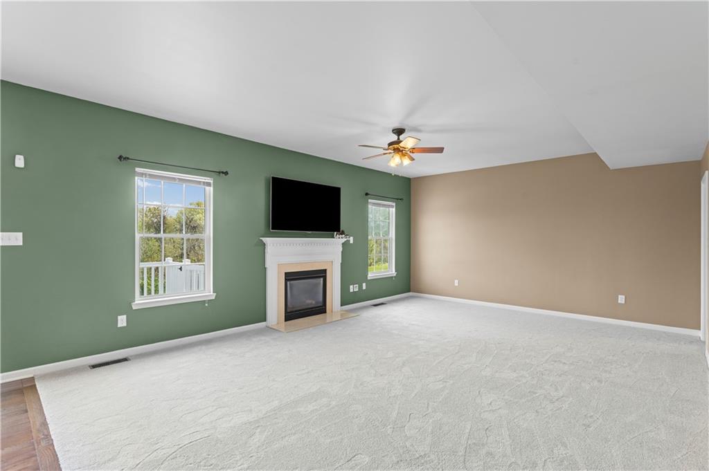 215 Long Ridge Drive Coraopolis, PA 15108 - Photo 16 of 50 a view of an empty room with a fireplace and a window