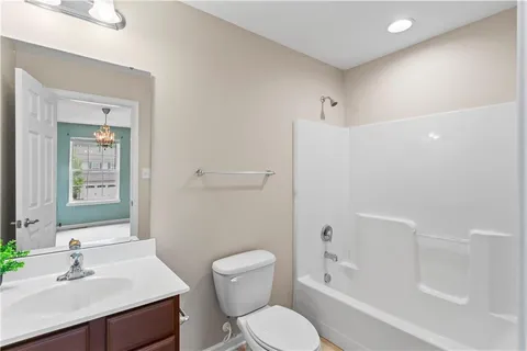 a bathroom with a bathtub and shower