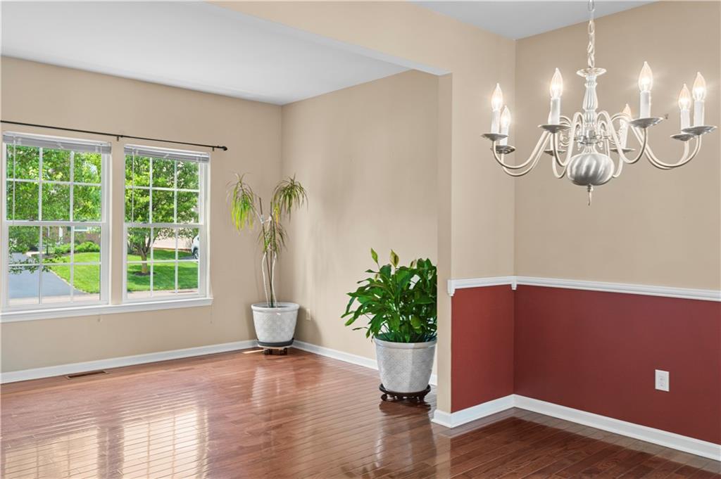 215 Long Ridge Drive Coraopolis, PA 15108 - Photo 3 of 50 a view of a room with a potted plant and wooden floor