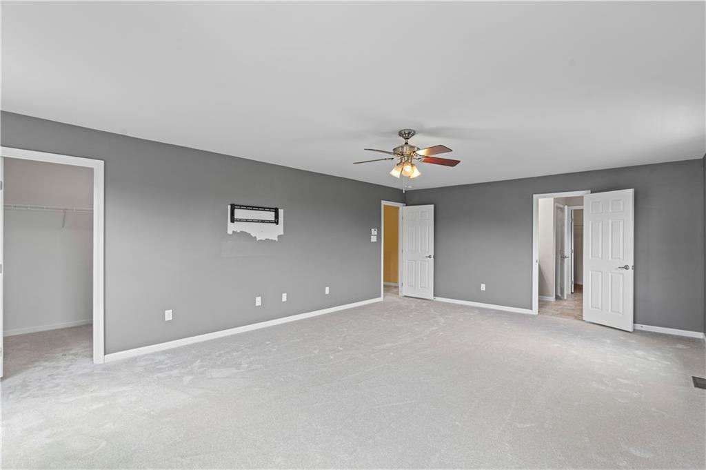 215 Long Ridge Drive Coraopolis, PA 15108 - Photo 32 of 50 a view of an empty room with a chandelier fan
