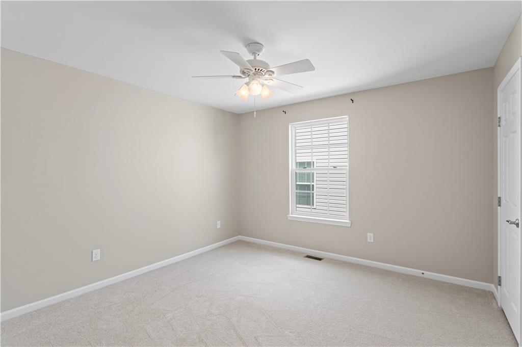 215 Long Ridge Drive Coraopolis, PA 15108 - Photo 39 of 50 an empty room with a window and a fan