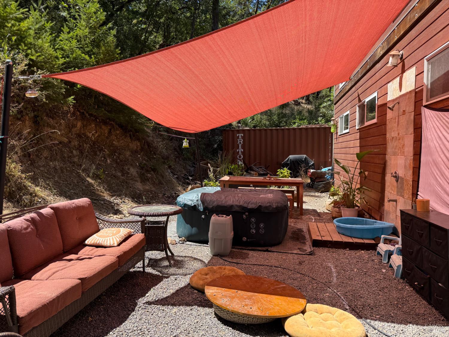 9355 Spyrock Road Laytonville, CA 95454 - Photo 18 of 22 a view of a patio with couches chairs and a fire pit