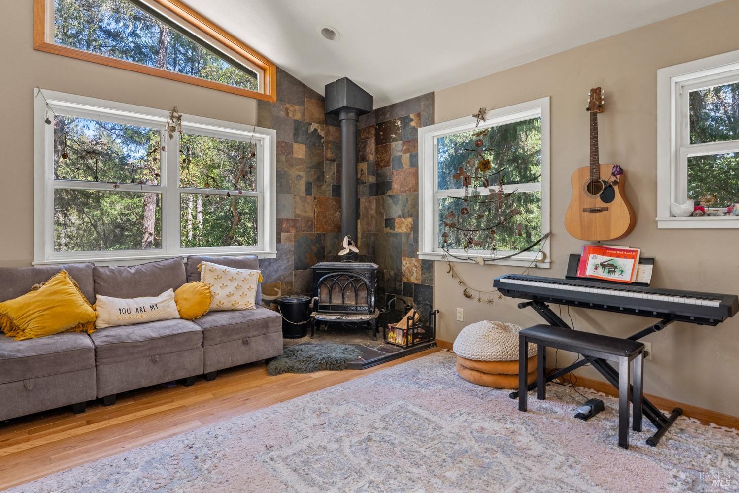 9355 Spyrock Road Laytonville, CA 95454 - Photo 6 of 22 a living room with furniture and a large window