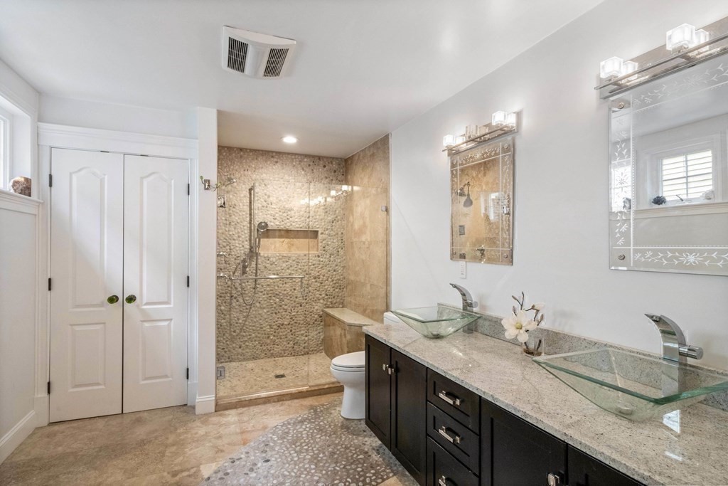 50 Baldwin Street Boston, MA 02129 - Photo 14 of 24 a bathroom with double vanity sinks and a shower