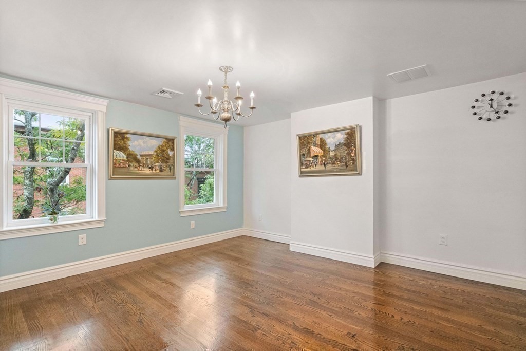 50 Baldwin Street Boston, MA 02129 - Photo 16 of 24 a view of an empty room with wooden floor and window