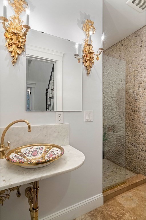 50 Baldwin Street Boston, MA 02129 - Photo 17 of 24 a bathroom with a sink a mirror and a shower