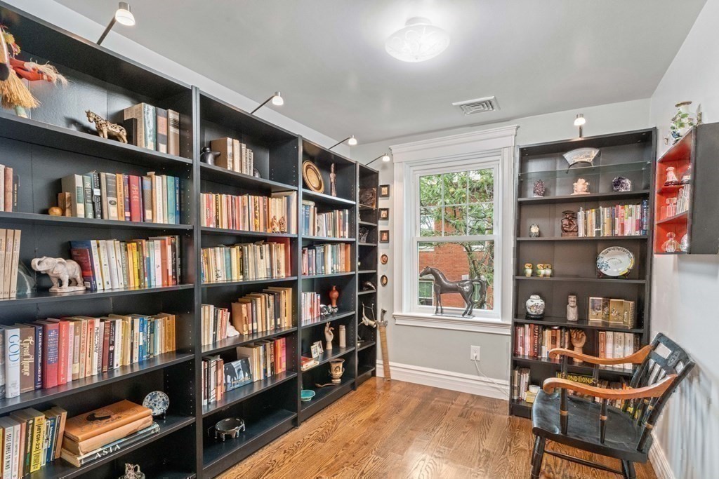 50 Baldwin Street Boston, MA 02129 - Photo 18 of 24 a living room with furniture and a book shelf