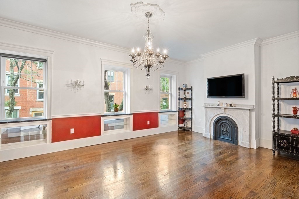 50 Baldwin Street Boston, MA 02129 - Photo 5 of 24 a living room with fireplace furniture and a flat screen tv