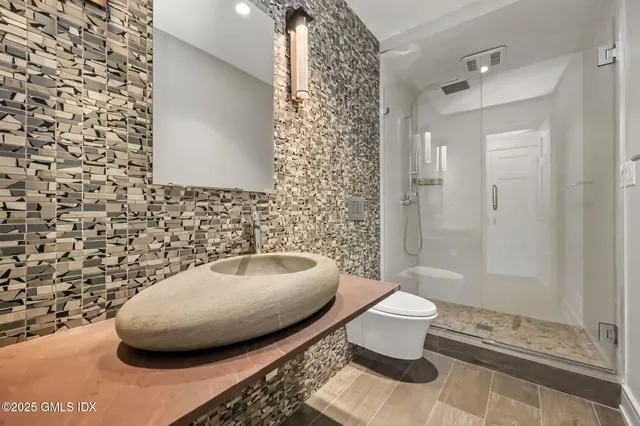 a bathroom with a toilet and a sink