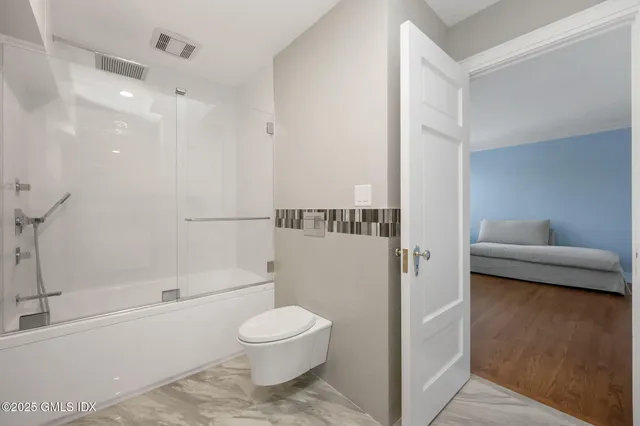 a bathroom with a toilet a sink and a bathtub