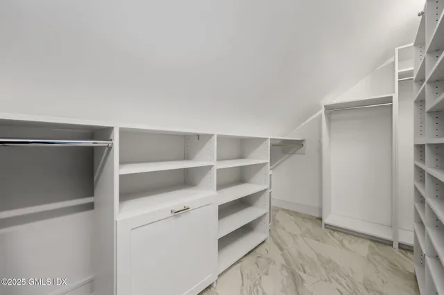 a view of an empty walk in closet