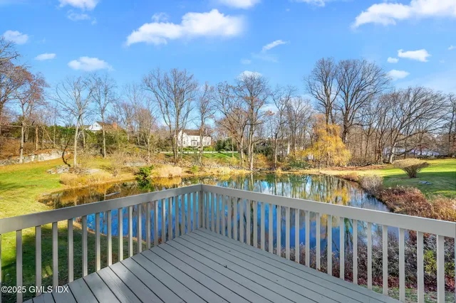 a view of outdoor space with deck and yard