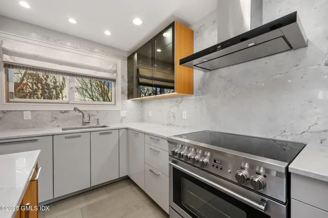 a kitchen with a sink and cabinets