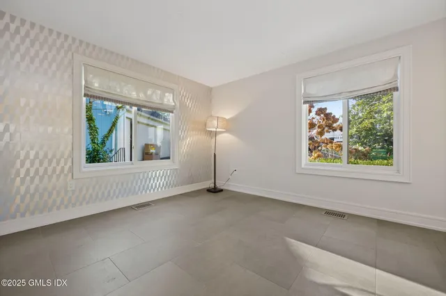 an empty room with windows