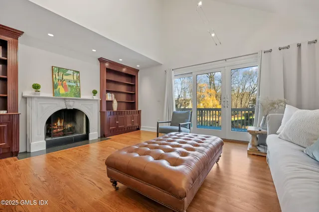 a bedroom with a bed and a fireplace