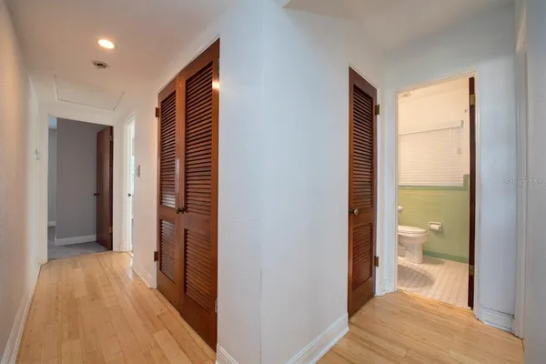 a view of a bathroom from a hallway