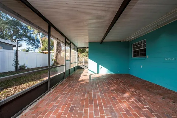 a view of a balcony with wooden floor