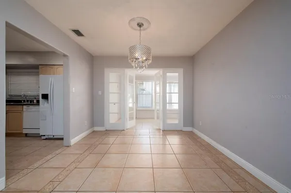 a view of an empty room and window