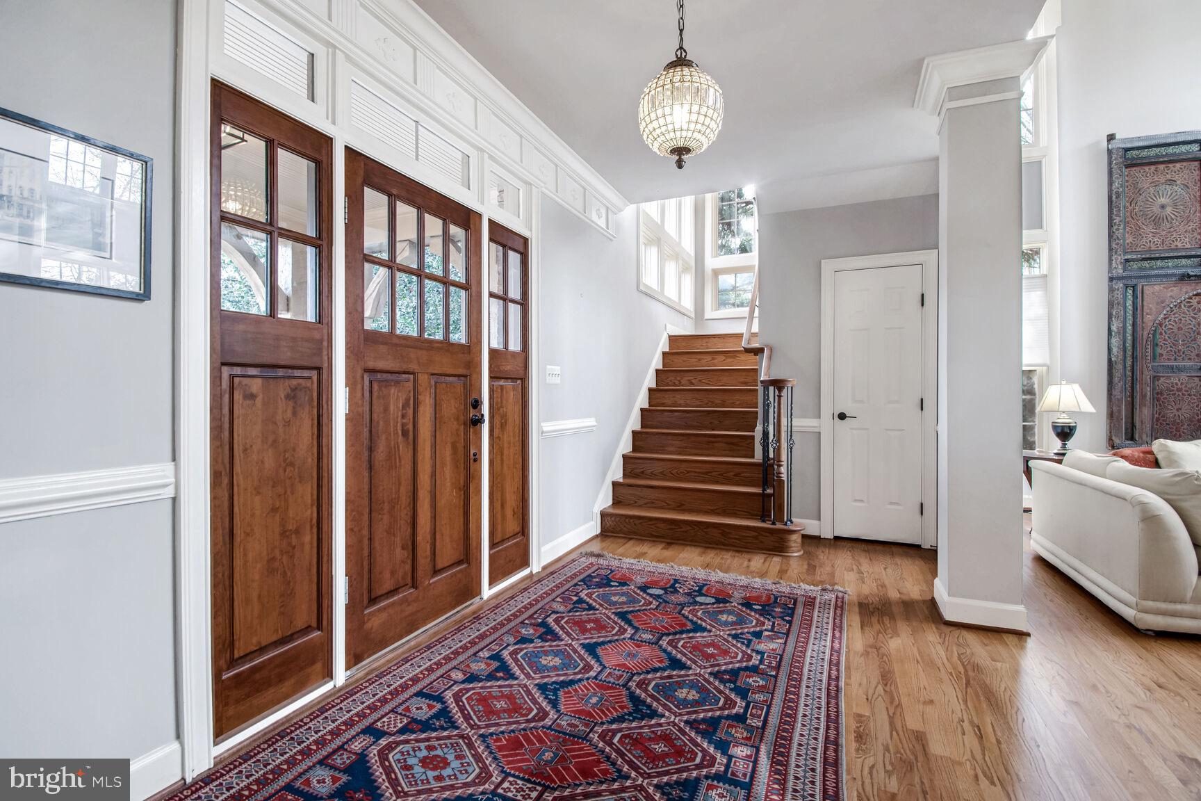 1550 Shelford Court Vienna, VA 22182 - Photo 12 of 60 a view of a hallway with wooden floor and staircase