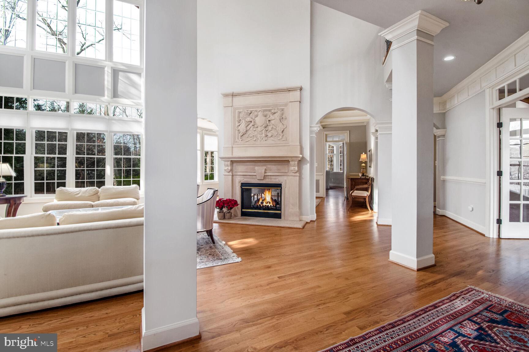 1550 Shelford Court Vienna, VA 22182 - Photo 13 of 60 a living room with furniture wooden floor and a fireplace