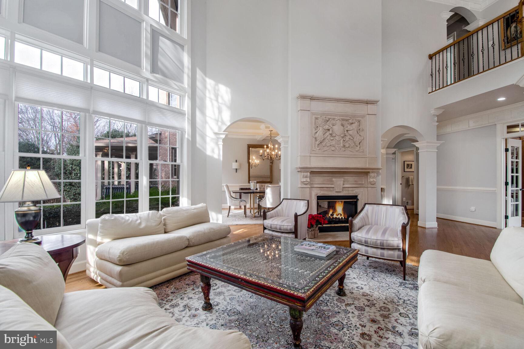 1550 Shelford Court Vienna, VA 22182 - Photo 17 of 60 a living room with furniture a fireplace and a large window