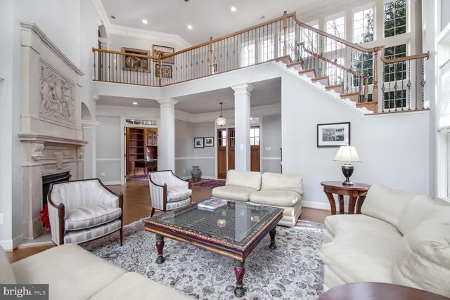 a kitchen with stainless steel appliances granite countertop a stove a sink dishwasher and a refrigerator with wooden floor