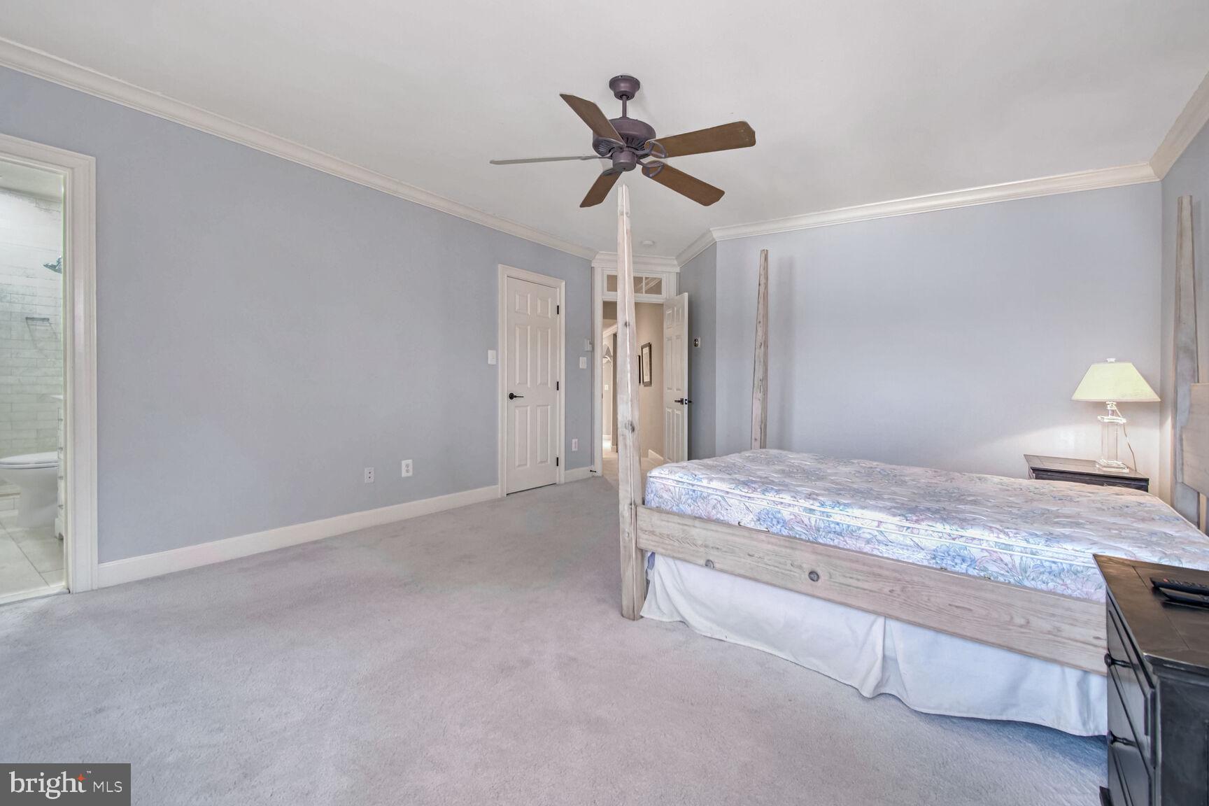 1550 Shelford Court Vienna, VA 22182 - Photo 34 of 60 a bedroom with a bed and a ceiling fan