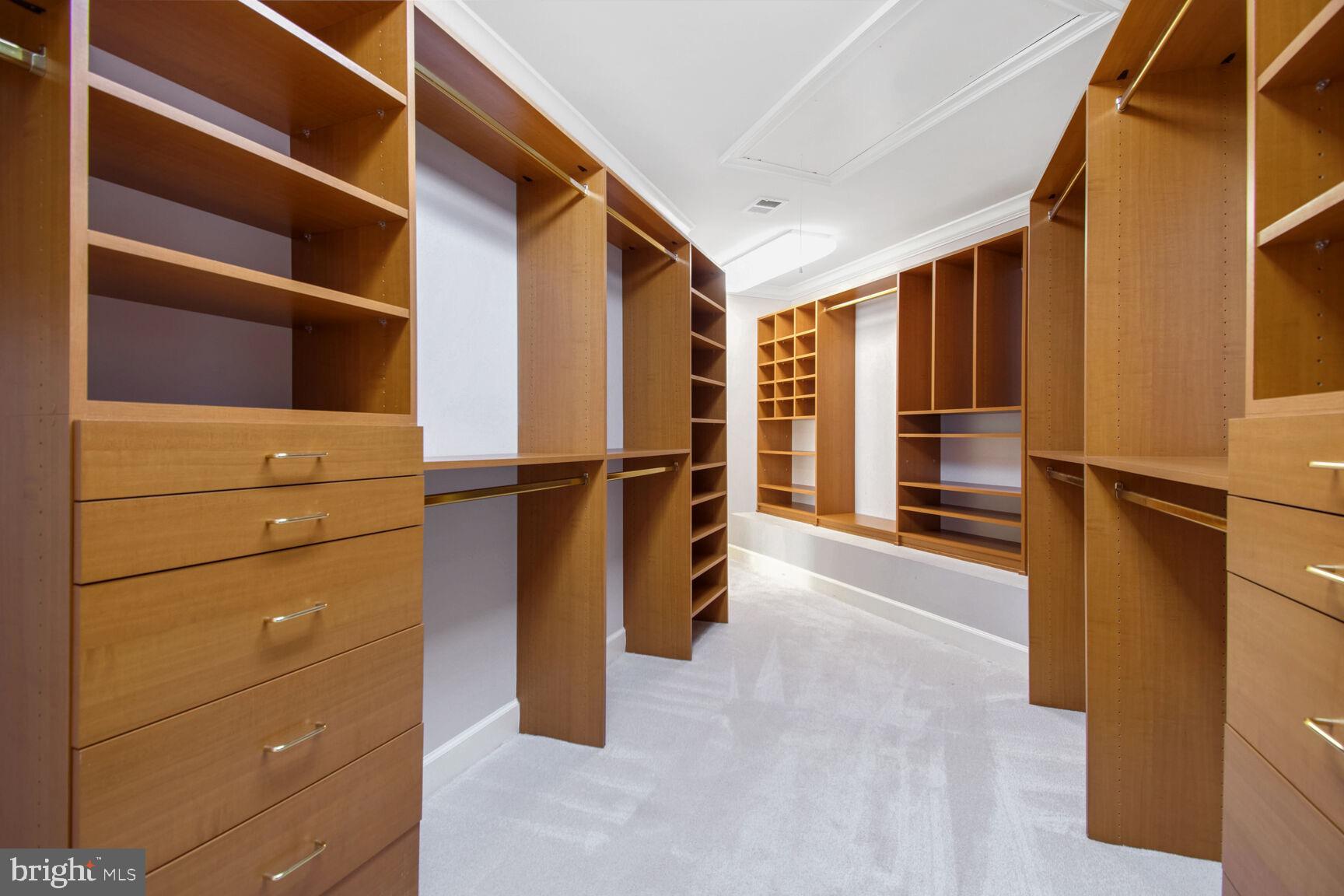 1550 Shelford Court Vienna, VA 22182 - Photo 36 of 60 a view of walk in closet with clothes and shoes