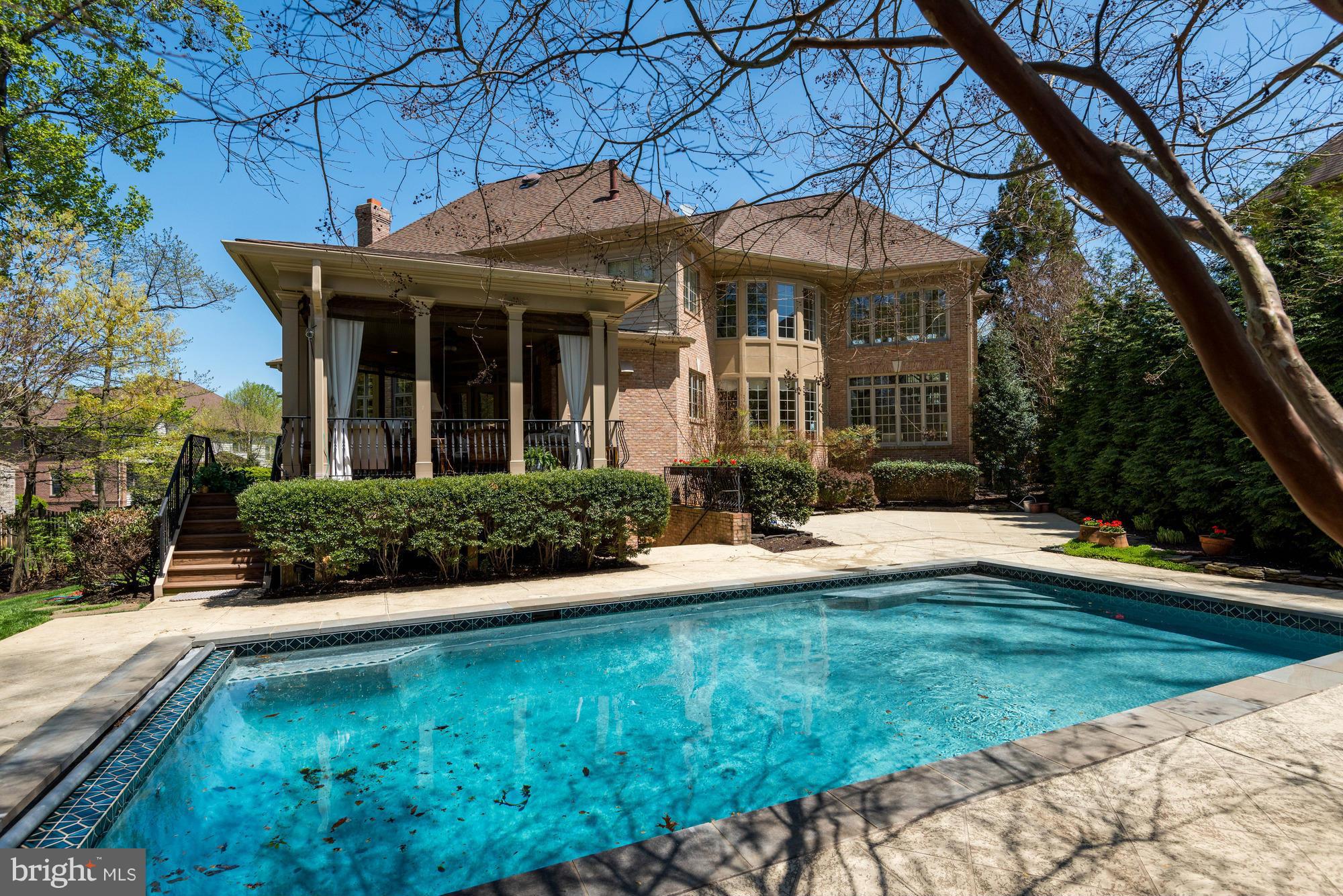 1550 Shelford Court Vienna, VA 22182 - Photo 4 of 60 a front view of a house with yard and green space