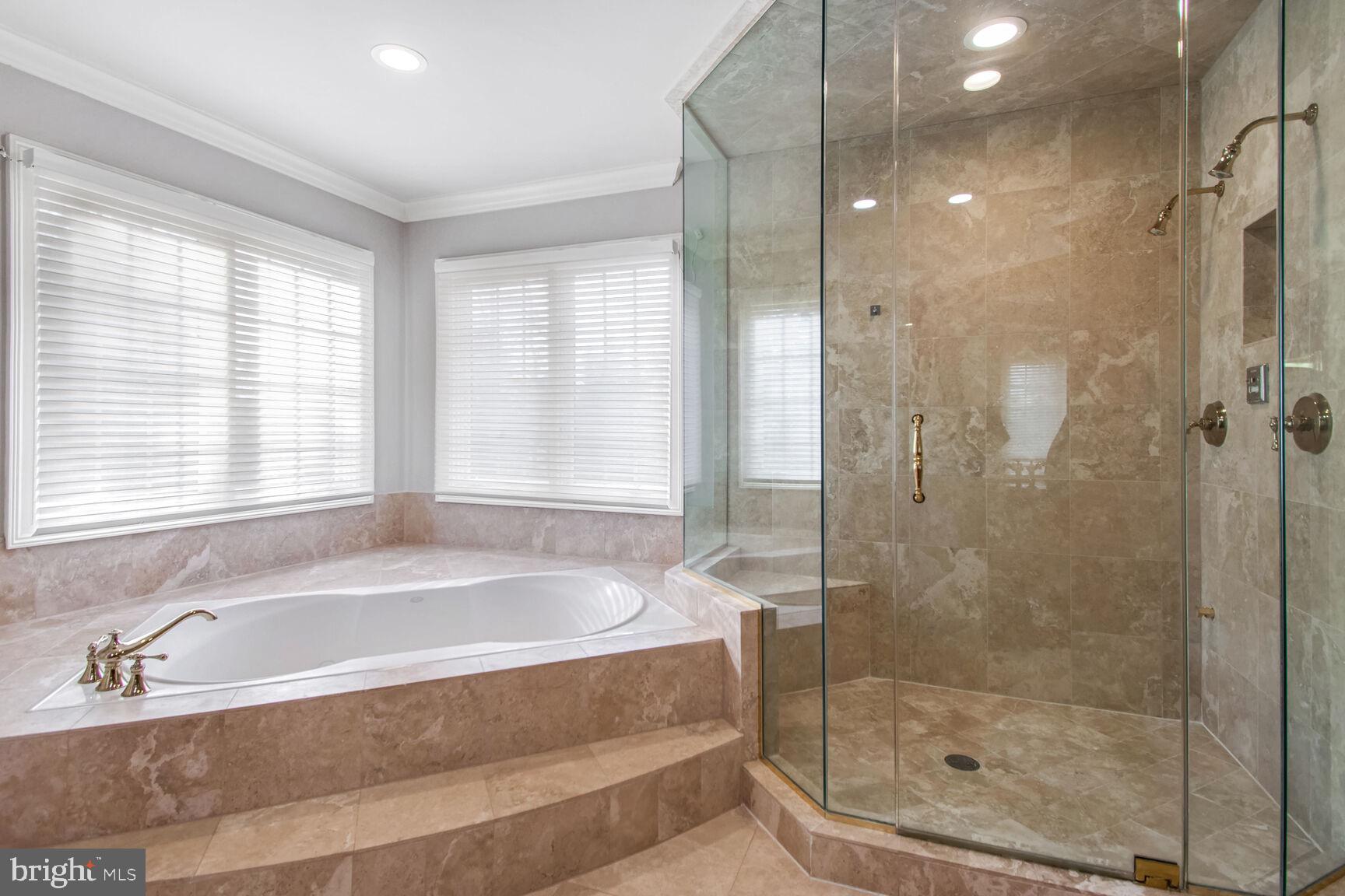 1550 Shelford Court Vienna, VA 22182 - Photo 41 of 60 a white bath tub sitting next to a shower