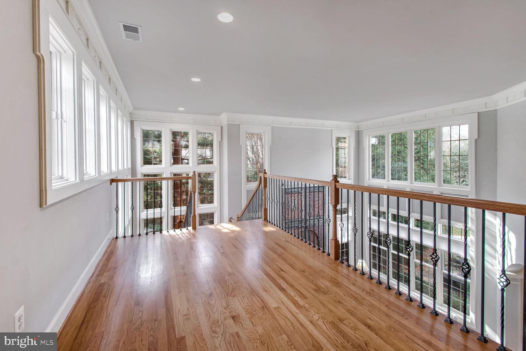 1550 Shelford Court Vienna, VA 22182 - Photo 42 of 60 a view of wooden floor and windows in a room