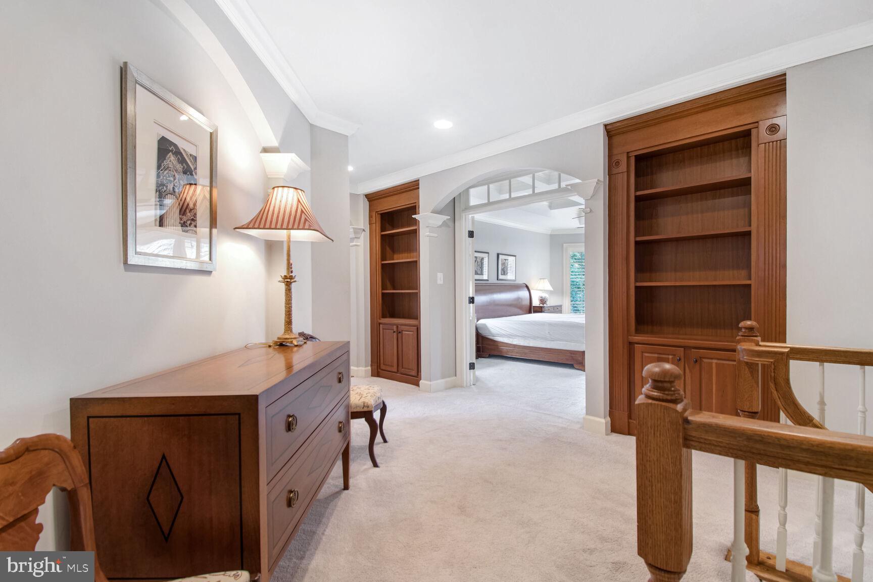 1550 Shelford Court Vienna, VA 22182 - Photo 44 of 60 a bedroom with furniture and a lamp