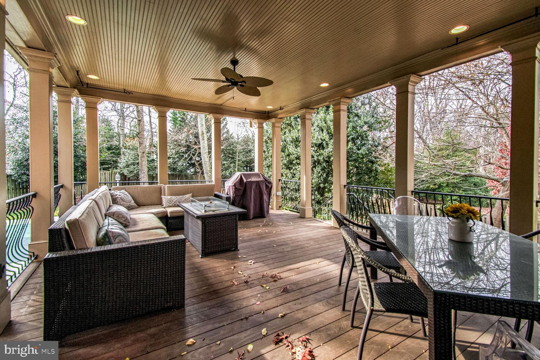1550 Shelford Court Vienna, VA 22182 - Photo 60 of 60 a view of a dining room with furniture large windows and wooden floor
