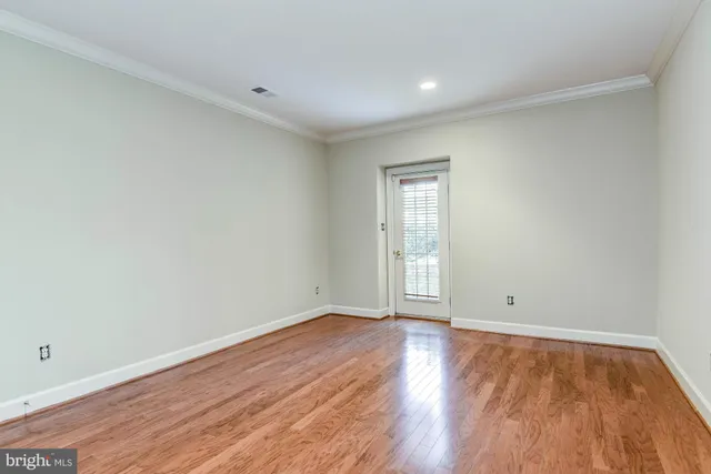 a view of a livingroom with an empty space and a window