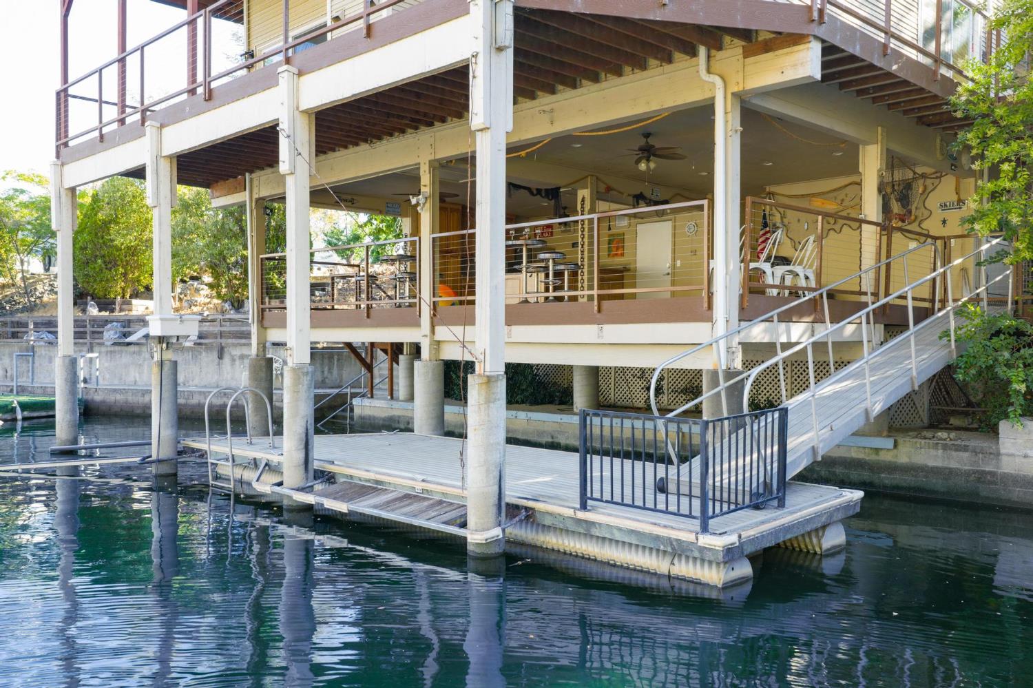 771 Mother Shipton Road Copperopolis, CA 95228 - Photo 2 of 72 Set up for fun on the lake & set lower on the lake with fewer stairs than most lakefront homes.