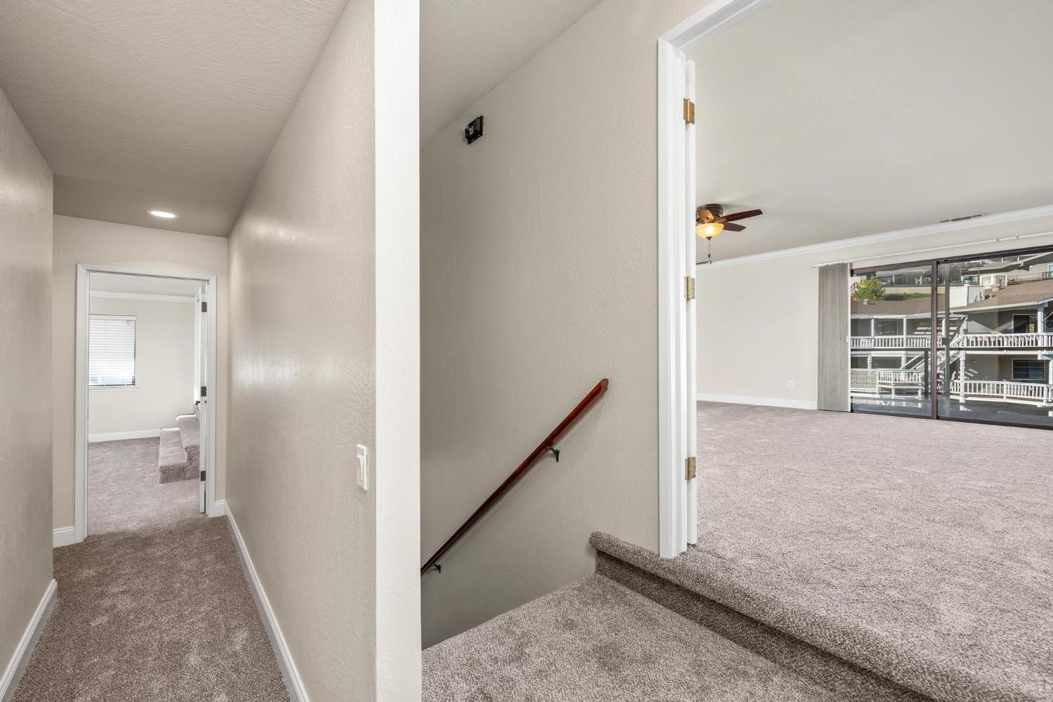 771 Mother Shipton Road Copperopolis, CA 95228 - Photo 32 of 72 Primary suite on the right, separated by stairs to the 3 bedroom unit on the left.